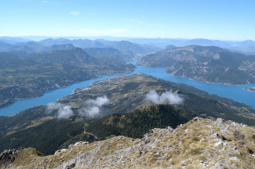 "Lac de Serre-Ponçon depuis le Pic de Morgon" by girolame is marked with CC BY 2.0.
